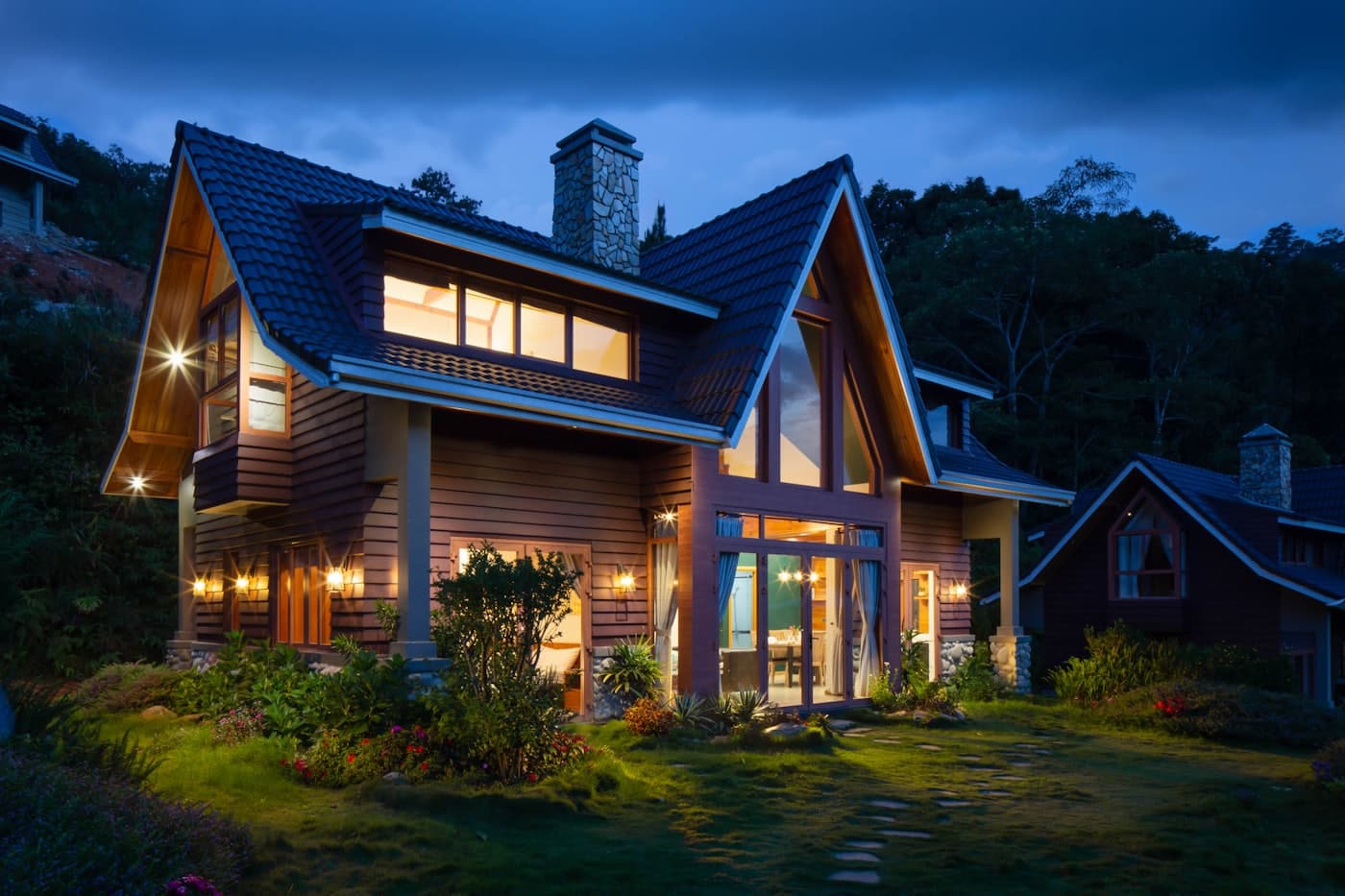 A modern home at dusk with a freshly finished pitched roof